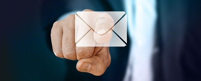 person pointing at email icon