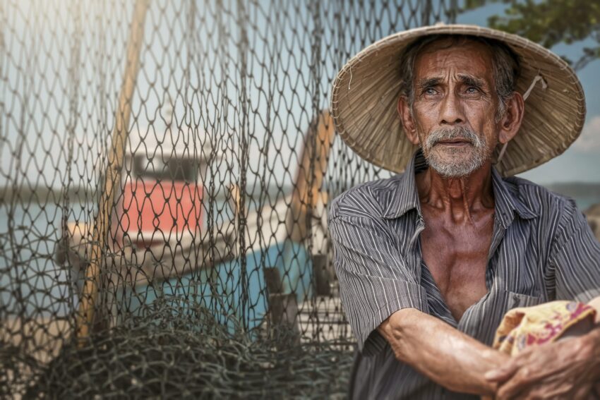 Old fisherman with his net