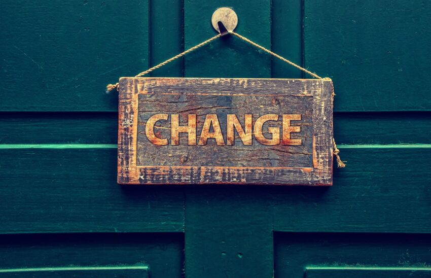 Sign on door with the word 'change.'